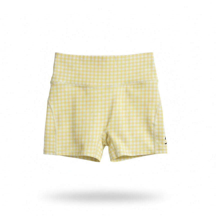 Pastel yellow gingham girls activewear bike shorts by Twyn Active
