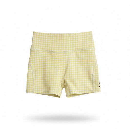 Pastel yellow gingham girls activewear bike shorts by Twyn Active