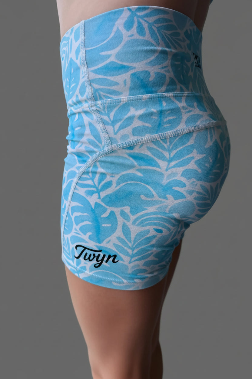 Blue tropical Aussie girls bike shorts. Girl wearing gym shorts