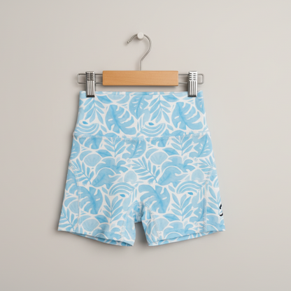 Blue shorts with white pattern on a hanger against a gray background