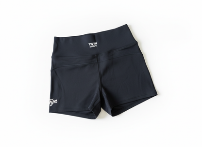 Black high-waisted bike shorts - back view